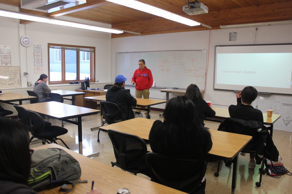 An instructor teaching his class.