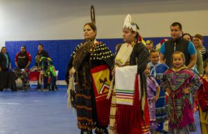 A procession of people in native american attire.